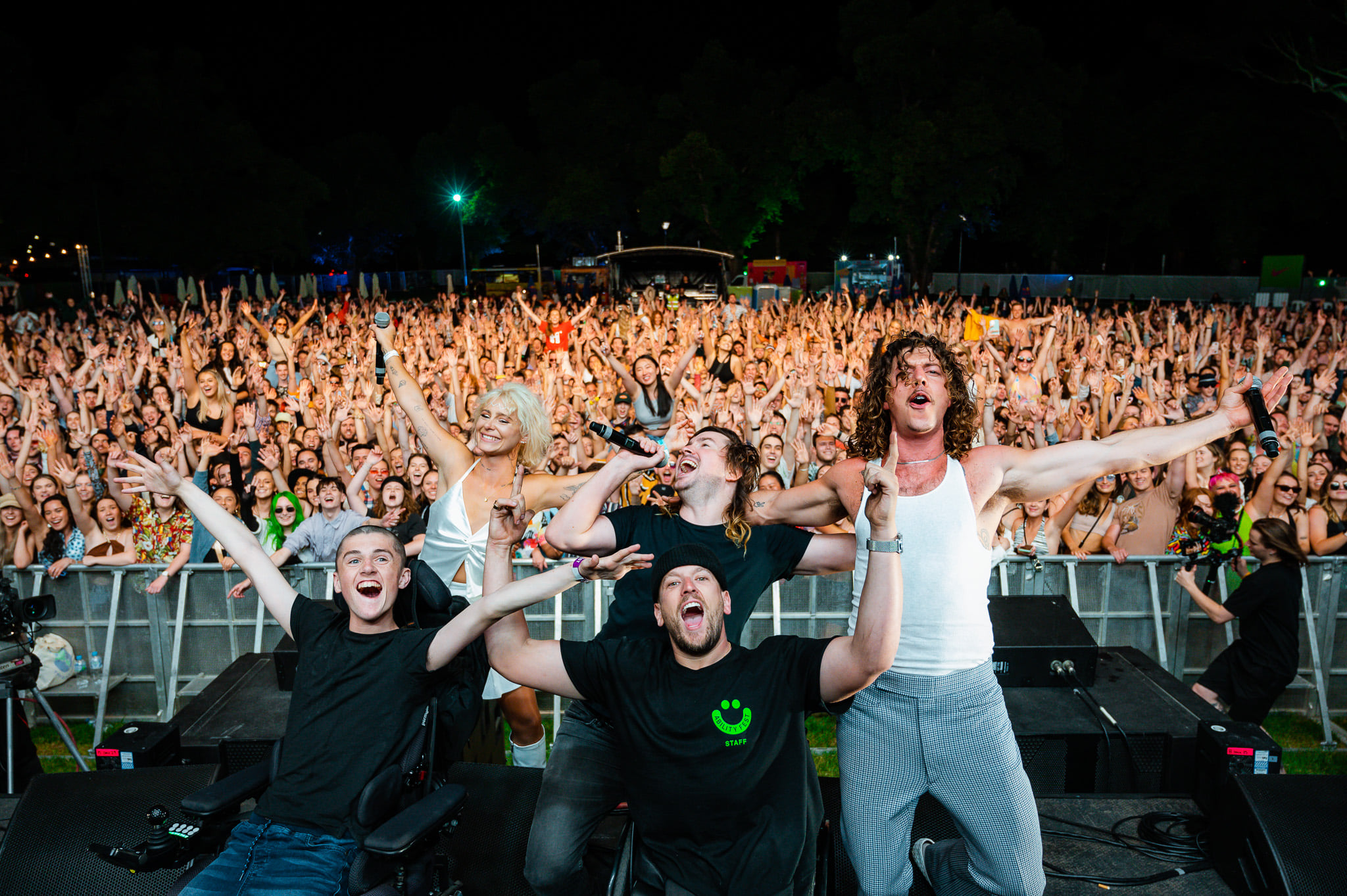 A large crowd of people cheering at Ability Fest. 