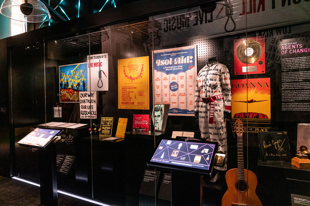 The Agents of Change exhibition at the Australian Music Vault featuring guitars, vinyl records and outfits worn by Australian musicians who have been at the forefront of public debate, addressing concerns and issues that impact society.