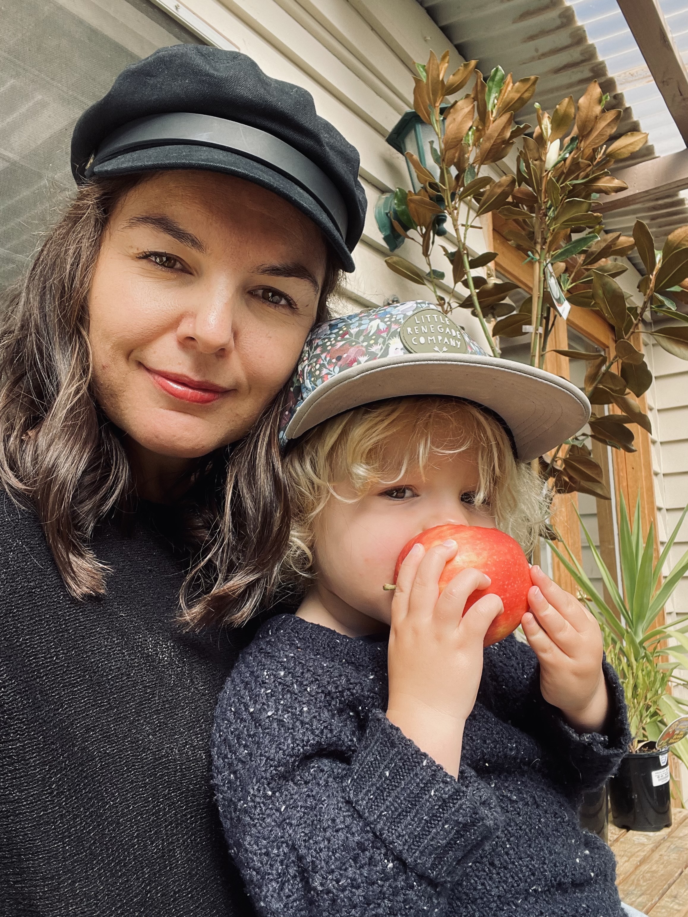 Eliza Hull sitting with her young child on her lap