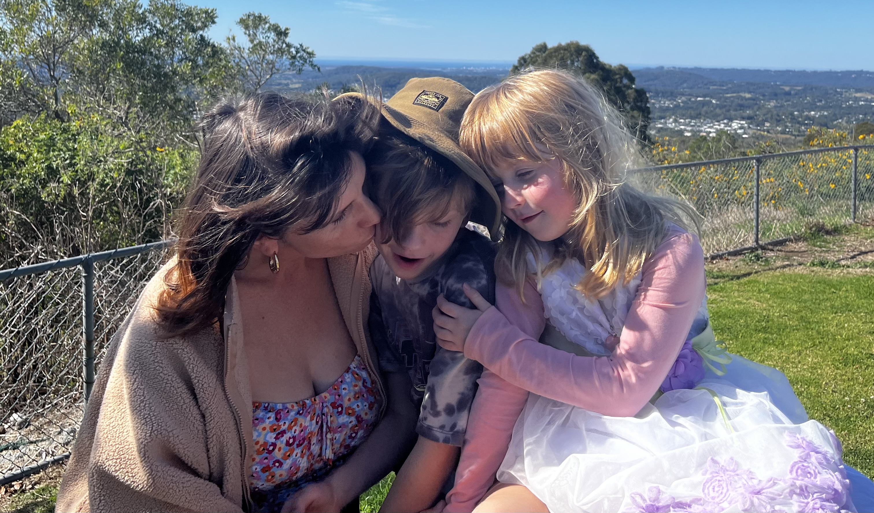 Emma Bosworth and her children sitting outside