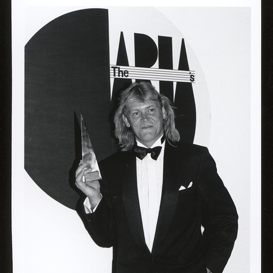 A black and white image of John Farnham at the Aria Awards in 1991. 