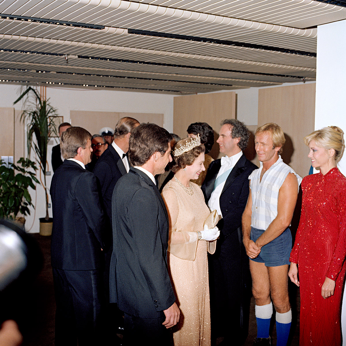 Her Majesty the Queen and Prince Philip meet Paul Hogan and Olivia Newton-John at the Royal Charity Concert